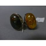 Two large hallmarked silver rings, one set with Amber, the other Moss Agate
