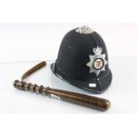 Avon and Somerset constabulary police helmet with a wooden truncheon