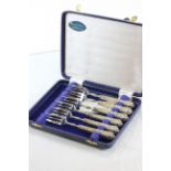 Cased set of six cake forks with hallmarked silver handles