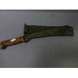 Military marked machete dated 1965, with canvas scabbard