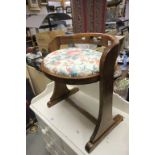 An oak Arts and Crafts stool