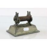 An antique table top tobacco shredder with patent plaque