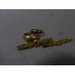 Two stone set 9ct Gold rings and two 9ct Gold bar brooches
