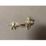 A silver dachshund dog brooch