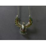 A silver and plique a jour necklace in the form of a phoenix