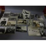 Approx 60 WW2 official military photographs to include: the Queen, a captured German, bombing raids,