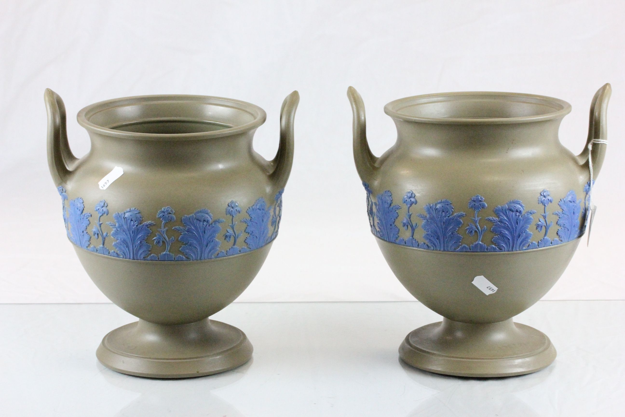 Pair of twin handled Wedgewood urns with impressed marks to base