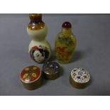 Glass snuff bottle, a pottery snuff bottle and three pill boxes with enamel decorated lids