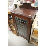 Edwardian Mahogany Cabinet, the single leaded glazed door opening to reveal shelves, with a pull