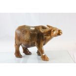 A well carved heavy wooden water buffalo