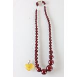 Cherry Amber Bakelite graduating bead necklace & Amber heart pendant with Gold mount