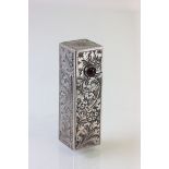 A continental silver lipstick holder, set with a single amethyst cabochon, with engraved decoration,