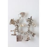 Silver charm bracelet with heavy charms