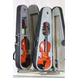 Two Modern Violins in Cases and a Folding Music Stand