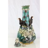 A large 19th century Continental Majolica baluster vase with two eagles safeguarding the elongated