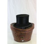 A Walter Barnard and Son antique top hat and leather hat box