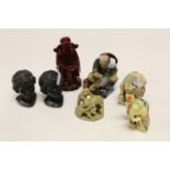 A carved soapstone group of monkeys and a group of other figures mainly resin.