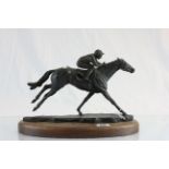 Resin Ltd Edition model of a racing horse with jockey with wooden base & marked Davina May 101/275