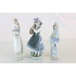 Three Lladro figures Lady Lamb and Lady with Flowers x 2