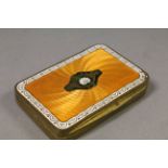 Gilt metal Snuff box with multi coloured Enamel lid