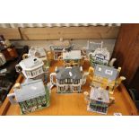 A group of Auntie Rose Village Collectables cottage teapots.