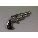 A Smiths Patent five shot. rim firecalibre revolver stamped to top and dated april 16 1873 no 41.