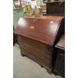 19th century Mahogany Bureau, the hinged drop front revealing a fitted bank of Fourteen Drawers over