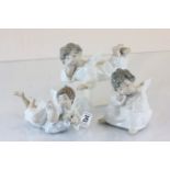 Three Lladro figures of angels at rest