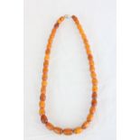 Butterscotch Amber necklace of 41 beads with total weight of approximately 52.7 grams, early 20th C