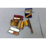 Nine cheroot holders including 15ct, 9ct and silver rims and butterscotch amber