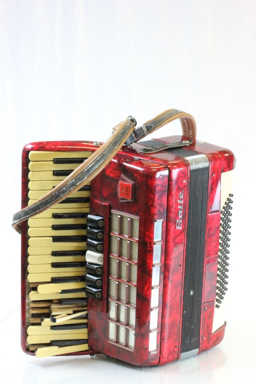 A cased Baile accordian for repair.