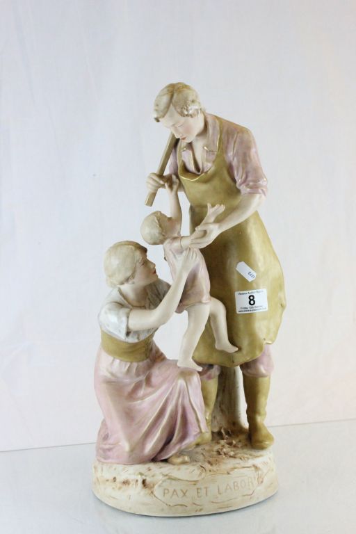 Royal Dux figurine of Blacksmith with family, with pink triangle mark to base and numbered 1944