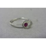 18ct White Gold Ruby and Diamond oval shaped cluster ring