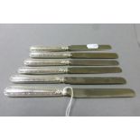 Set of six hallmarked Silver handled dessert knives with blades all marked "Asprey"