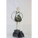 Art Deco style resin & brass figure of a girl with hoop