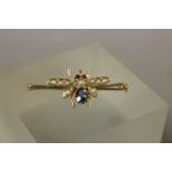 Gold (unmarked 15ct) Bee Bar Brooch set with Seed Pearls, Rubies and a Sapphire