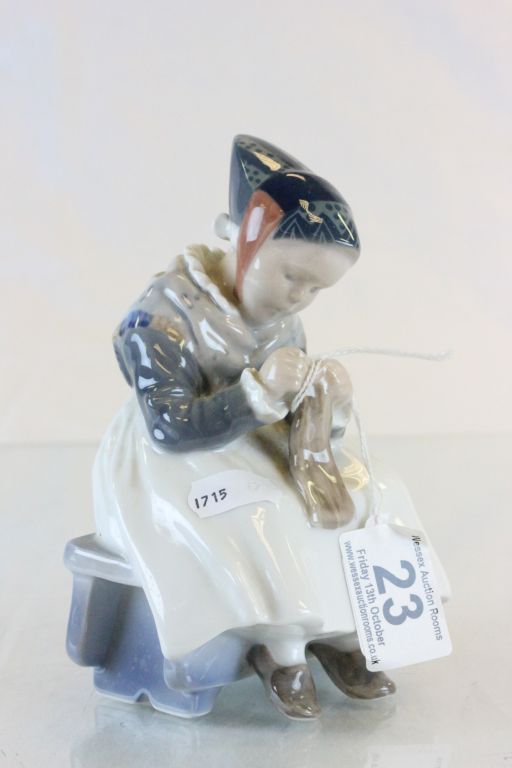 Royal Copenhagen figurine of a lady sewing and numbered 1314 to base