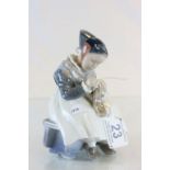 Royal Copenhagen figurine of a lady sewing and numbered 1314 to base