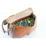 Vintage leather bag and marbles