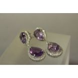 Pair of good Silver and Amethyst double drop earrings surrounded by CZ's