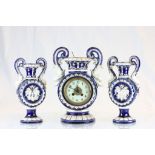 Late 19th Century Continental ceramic clock garniture with dolphin handles