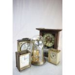 Antique two train mantle clock,an anniversary clock and two others.