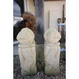 Pair of Reconstituted Stone Garden Ornaments in the form of Unusual Men with their Heads on the