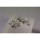 Pair of Silver dog and bone cufflinks