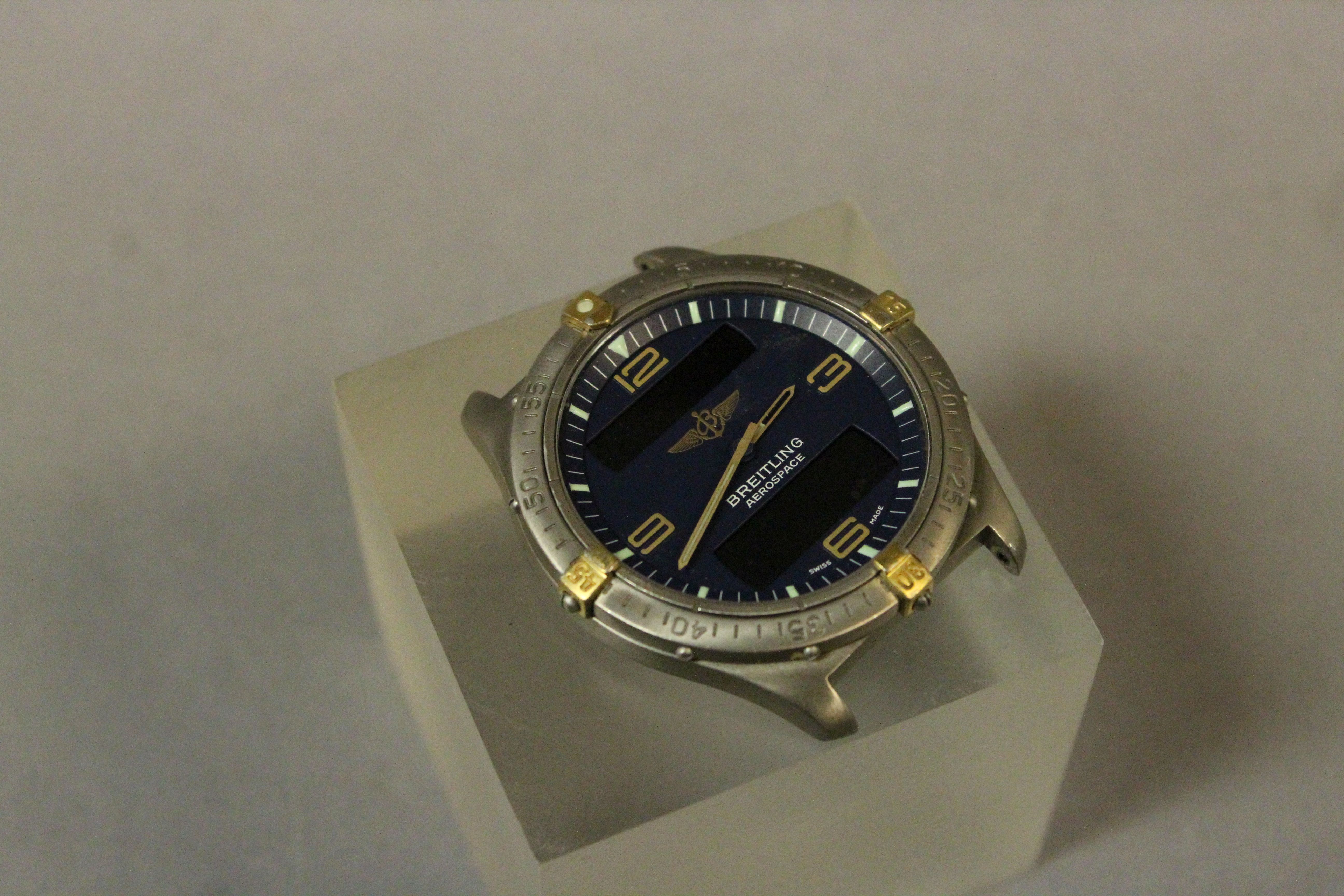 Gents Breitling Aerospace with a blue face, lacking strap