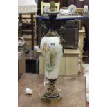 Sevres style lamp, decorated with a single lady and a cherub, with gilt brass handles and mount.