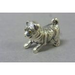 Solid Silver figure of a dog with glass eyes