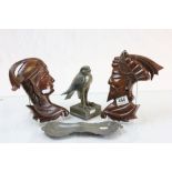 Art Nouveau style pewter dish, bronze figure of a bird of prey and two wooden South Sea Island wall