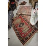 Two Middle Eastern wool rugs and two prayer mats