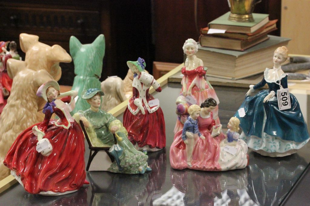 Six Royal Doulton figures to include Christmas Morn,Janine,Autumn Breezes,Ascot and Bedtime Story.